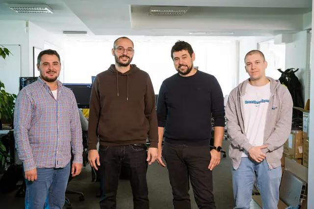 Four eFellows engineers in the office